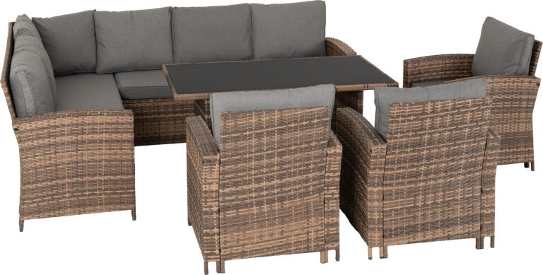 Outdoor furniture set with wicker chairs and table on a white background