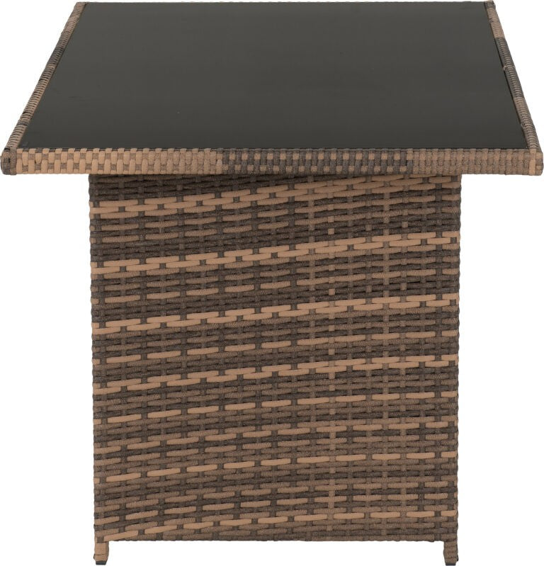 Wicker side table with a black glass top on a white background
