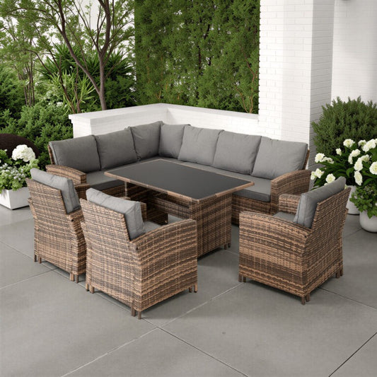 Outdoor patio furniture set with gray cushions on a patio.