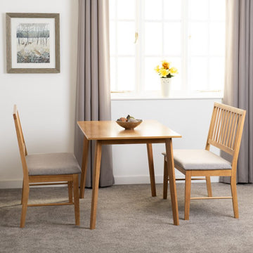 Austin 1+2 Dining Bench Set - A
wooden table and 2 benches in a room with a window and framed picture.