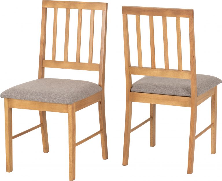 Two Austin dining wooden chairs with gray cushioned seats on a white background