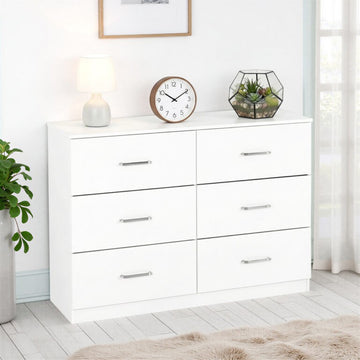 Dakota 6 Drawer Chest -White dresser with decorative items in a room setting