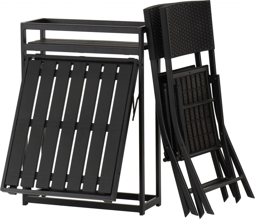 Black metal folding chairs stacked on a white background