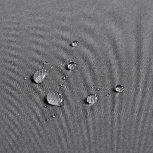 Water droplets on a textured gray surface