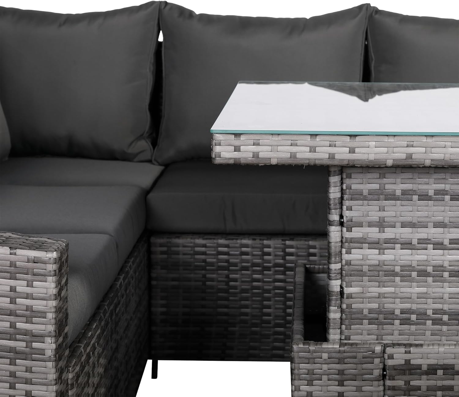 Sectional outdoor sofa with dark cushions and a glass-top table.