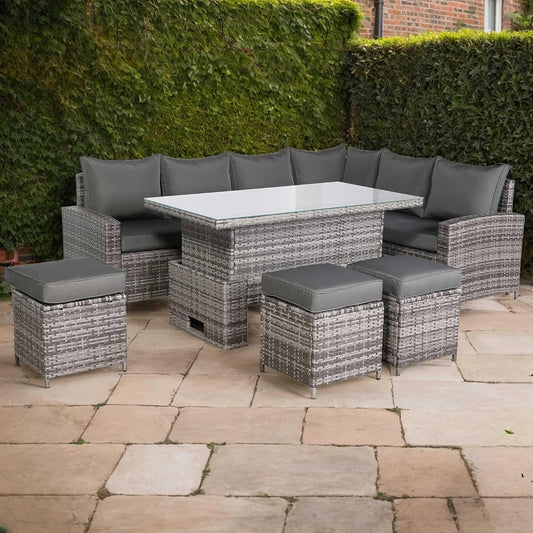 Outdoor patio set with gray cushions on a stone patio