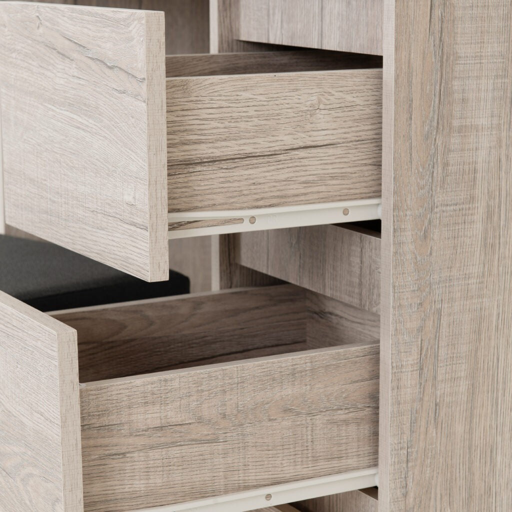 Wooden cabinet with open drawers in a neutral color scheme