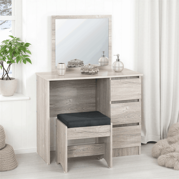 Dressing table with mirror, stool, and decorative items in a room setting.