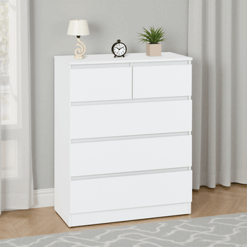 White dresser with decorative items in a room with curtains and a rug.