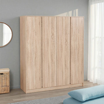 Wooden wardrobe in a room with a mirror and basket on a gray wall.