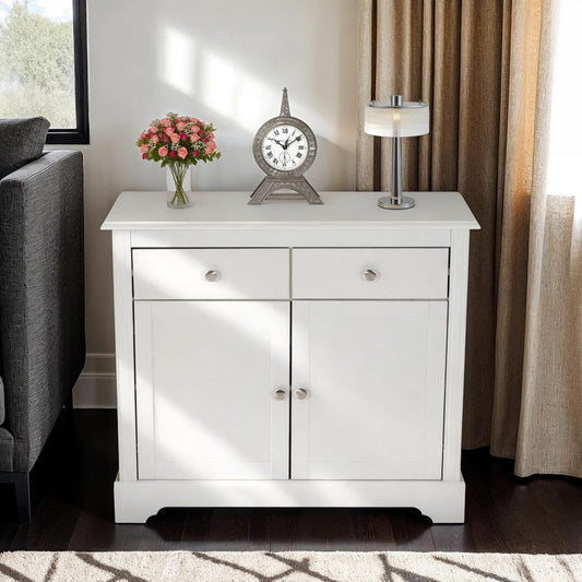 White sideboard with decorative items in a living room setting