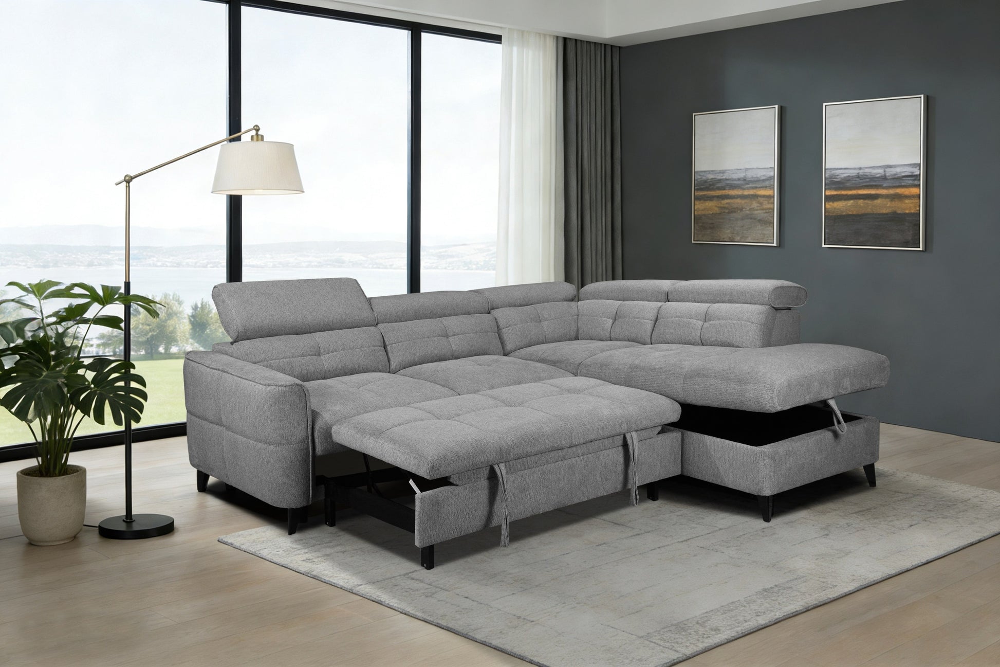 Gray sectional sofa with pull-out bed in a living room setting.