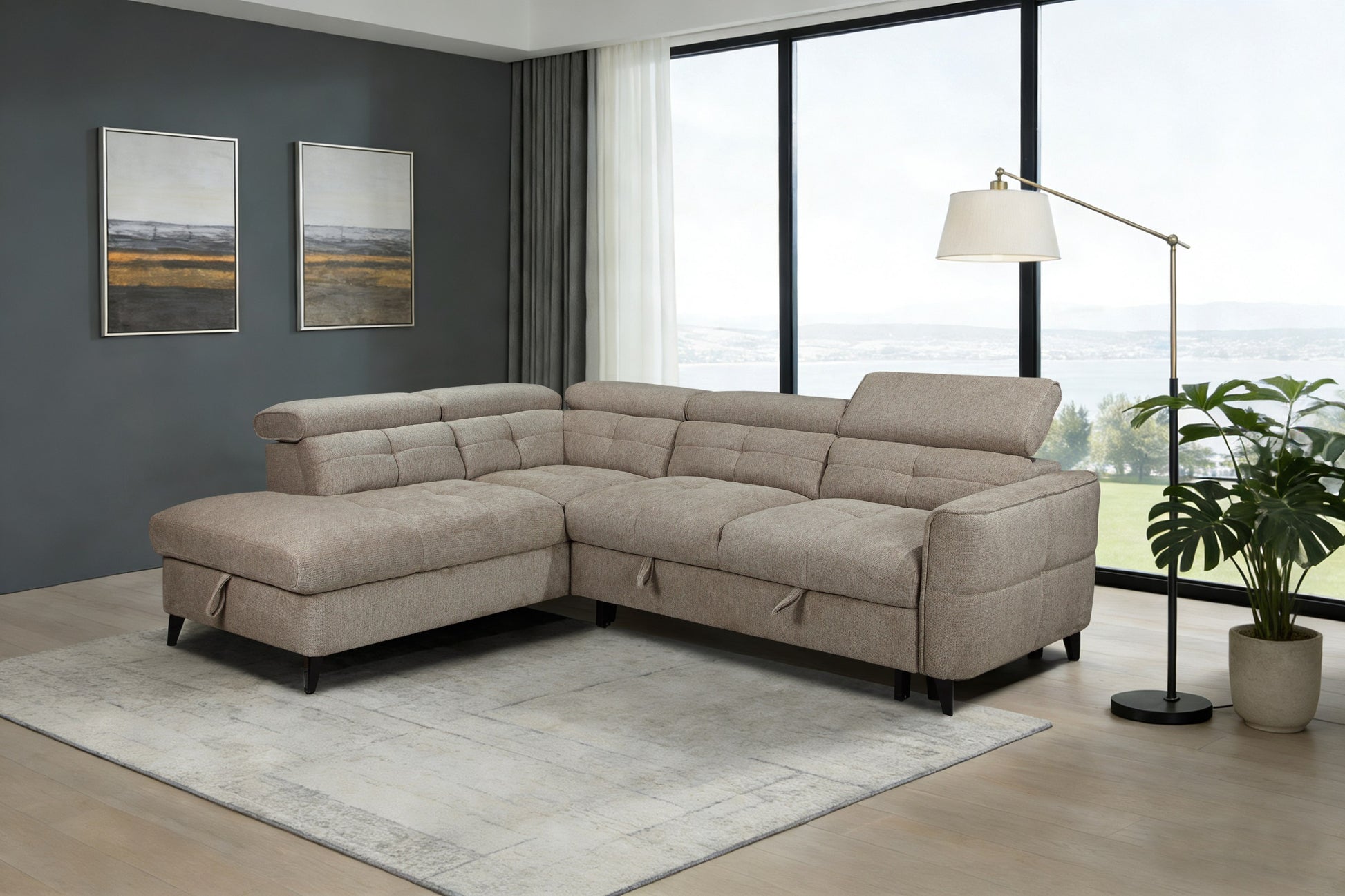 Beige sectional sofa in a living room with large windows and decor.