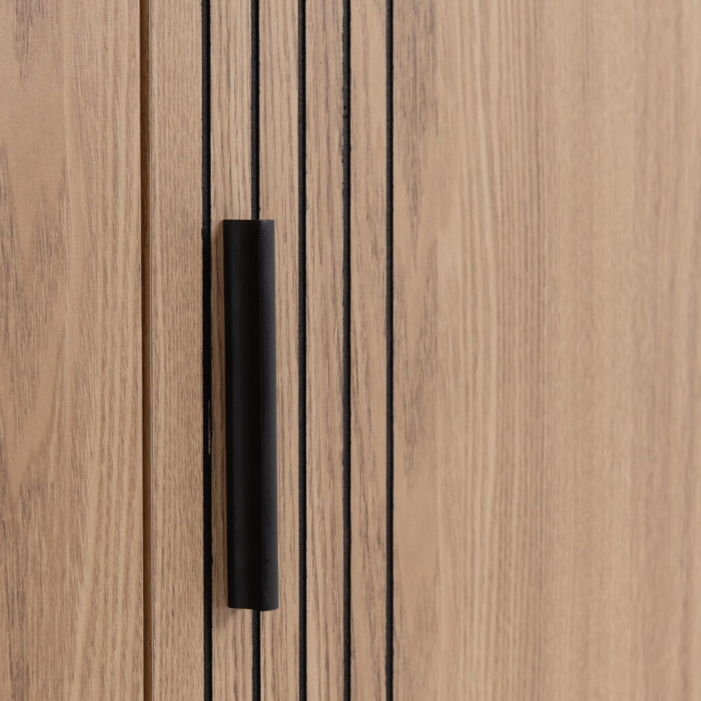 Close-up of a wooden door with a black handle