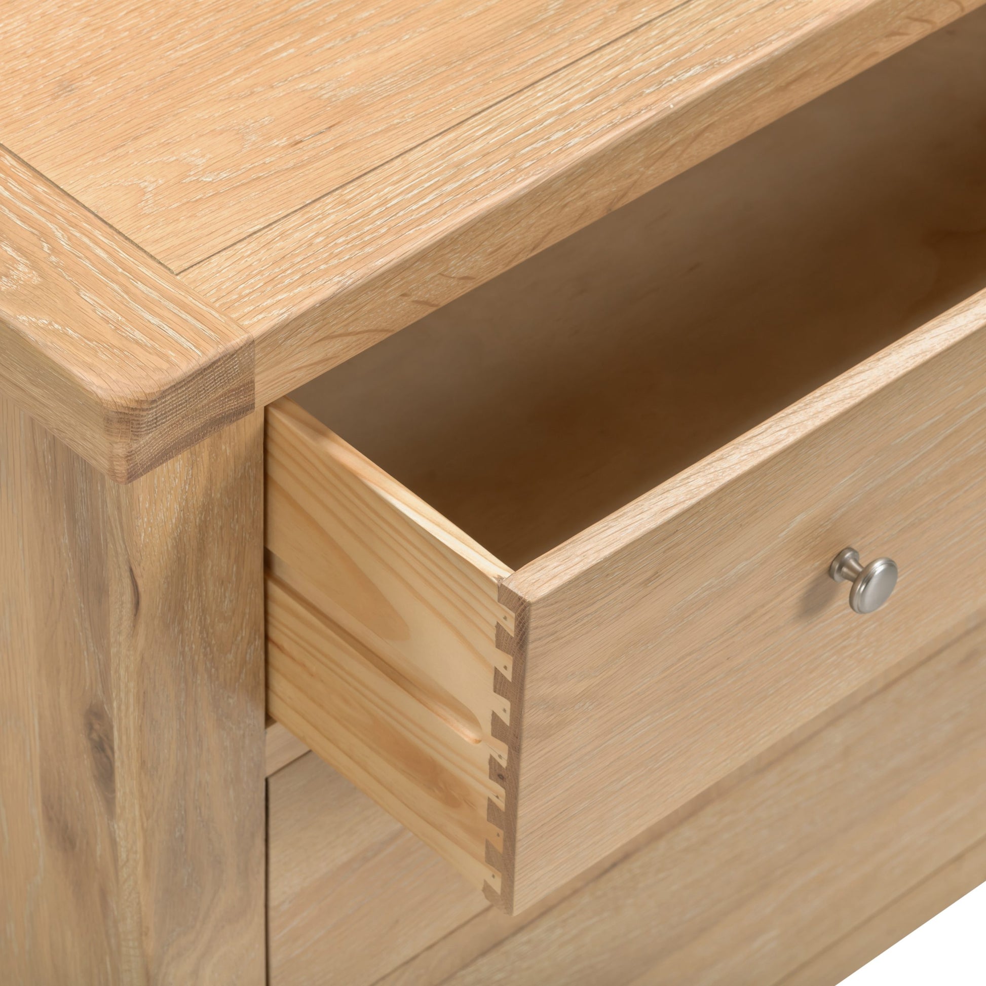 Wooden drawer being pulled out from a wooden cabinet.