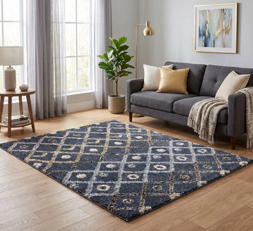 Alaska 4 dark grey diamond-pattern rug on a wooden floor in front of a dark grey sofa