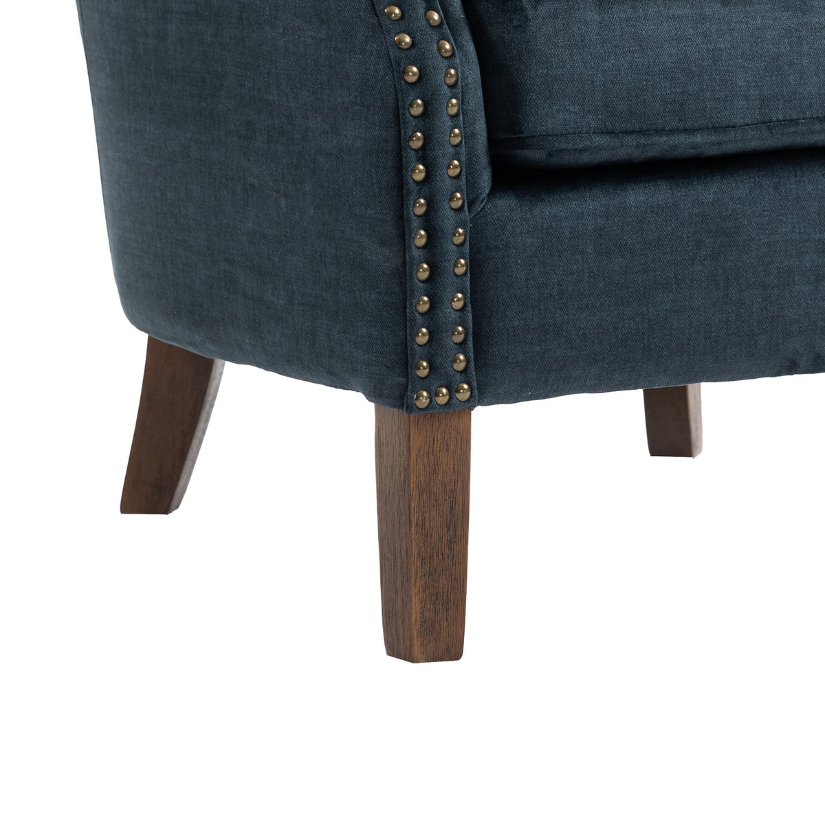 Harlow Deep Ocean fabric armchair, studs and leg detail