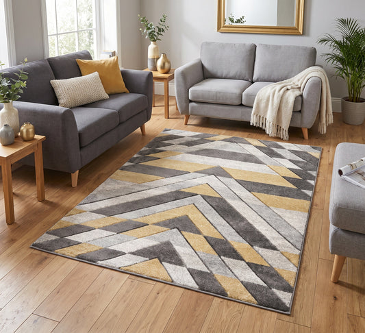 Asher Rug Grey-Mustard, grey and mustard geometric rug between grey sofas on a wooden floor
