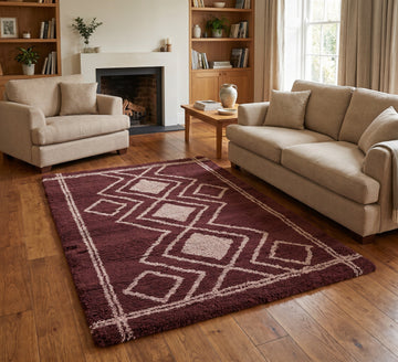 Ashton Rug - Ivory Orange, ivory and orange diamond-pattern rug between beige seating beside a fireplace