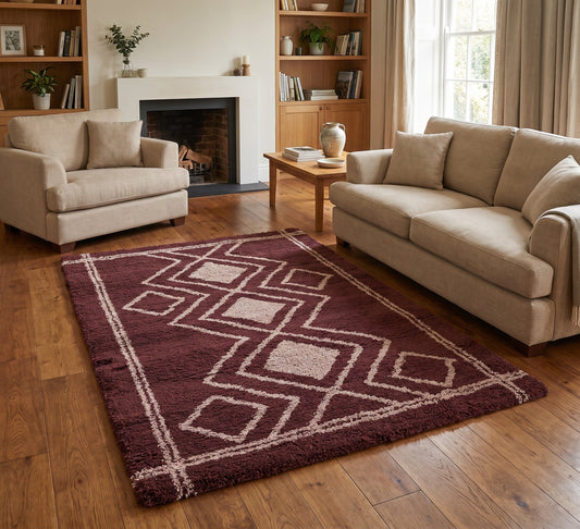 Ashton Rug - Ivory Orange, ivory and orange diamond-pattern rug between beige seating beside a fireplace