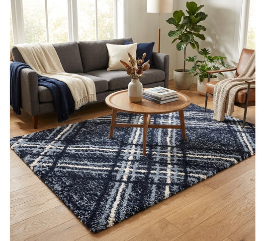 Blaze Rug - Navy Blue, navy checked rug beneath a round coffee table beside a sofa
