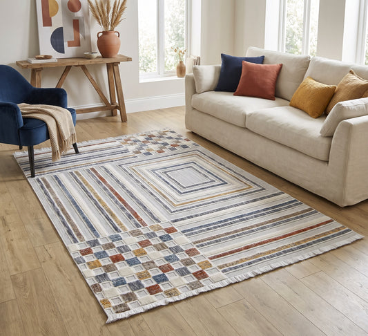 Broadway Rug - 4950A, striped and checkerboard rug beside a cream sofa