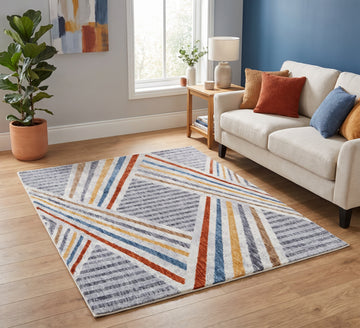 Broadway Rug - 5296A, diagonal-striped rug beside a cream sofa