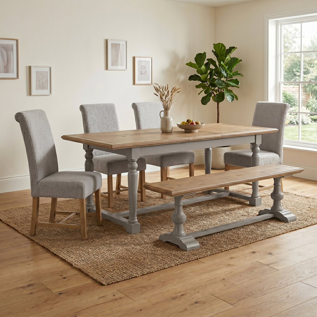 Chateau extending table with grey chairs and bench in a room setting