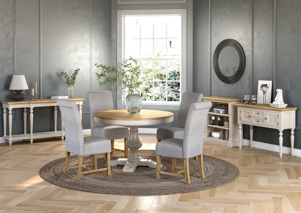 Chateau grey painted collection with round dining set in a room setting