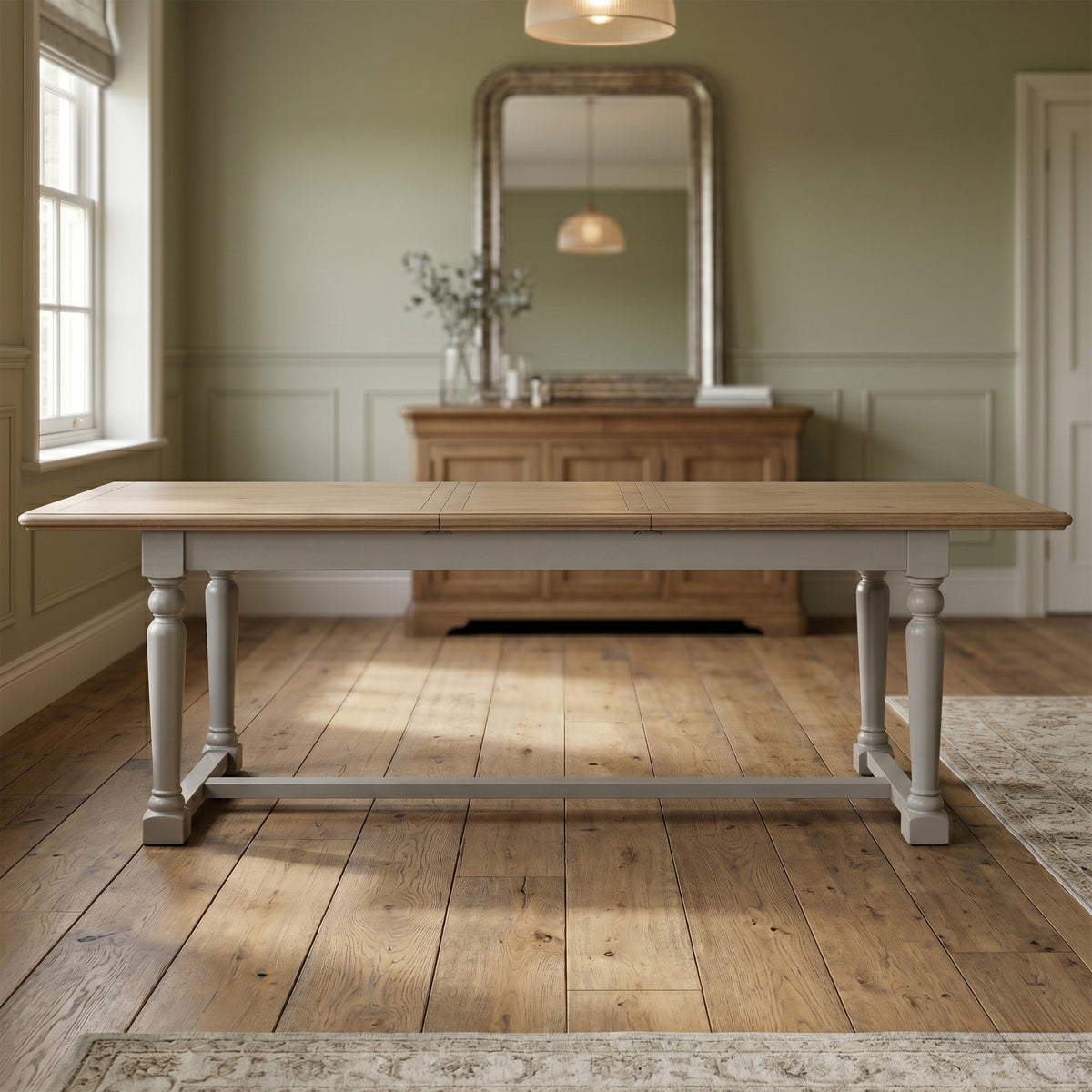 Chateau grey painted extending pine dining table in a room setting