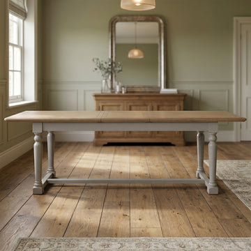 Chateau grey painted extending pine dining table in a room setting