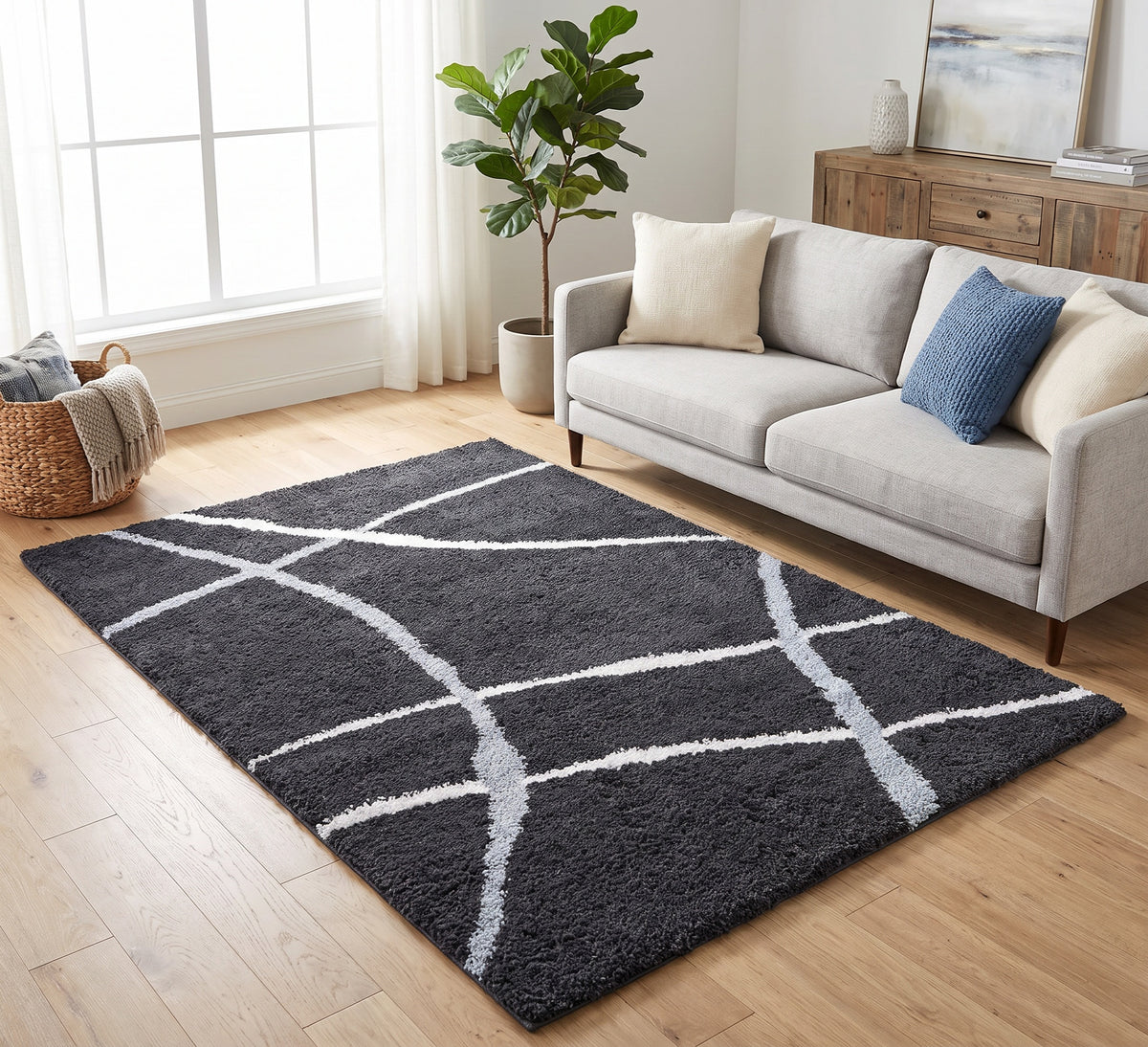 Cruz Rug - Black, black rug with curved cream lines beside a cream sofa