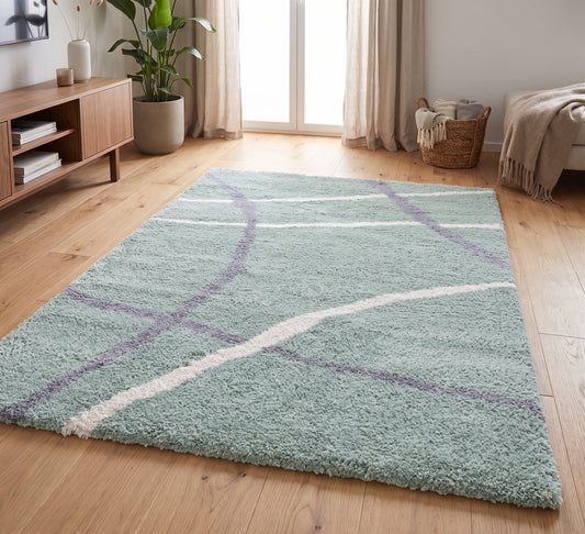Cruz Rug - Green, green rug with curved cream and grey lines in a bright living room