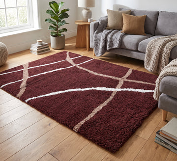 Cruz Rug - Red, red rug with curved cream lines beside grey seating