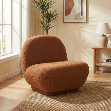 Maisie Rust fabric accent chair in a styled room