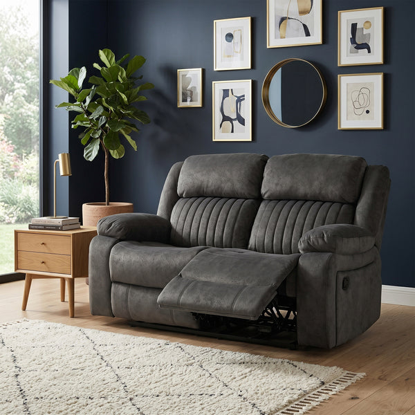 Morgan 2 Seater Manual Recliner Sofa in Iron, in a living room setting with a footrest extended