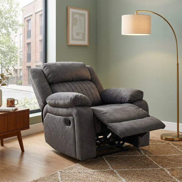 Morgan Manual Recliner Armchair in Iron, in a living room setting with a footrest extended
