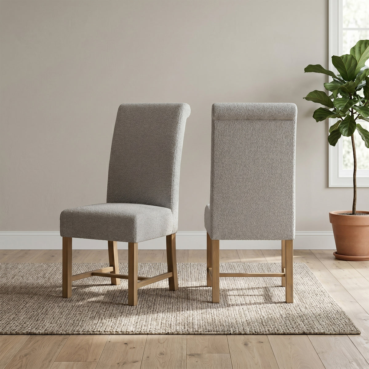 Pair of Chateau grey upholstered dining chairs in a room setting