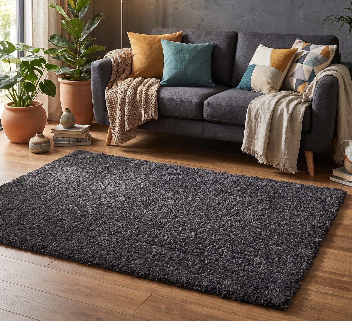 Empire Rug Charcoal, charcoal shaggy rug beside a grey sofa