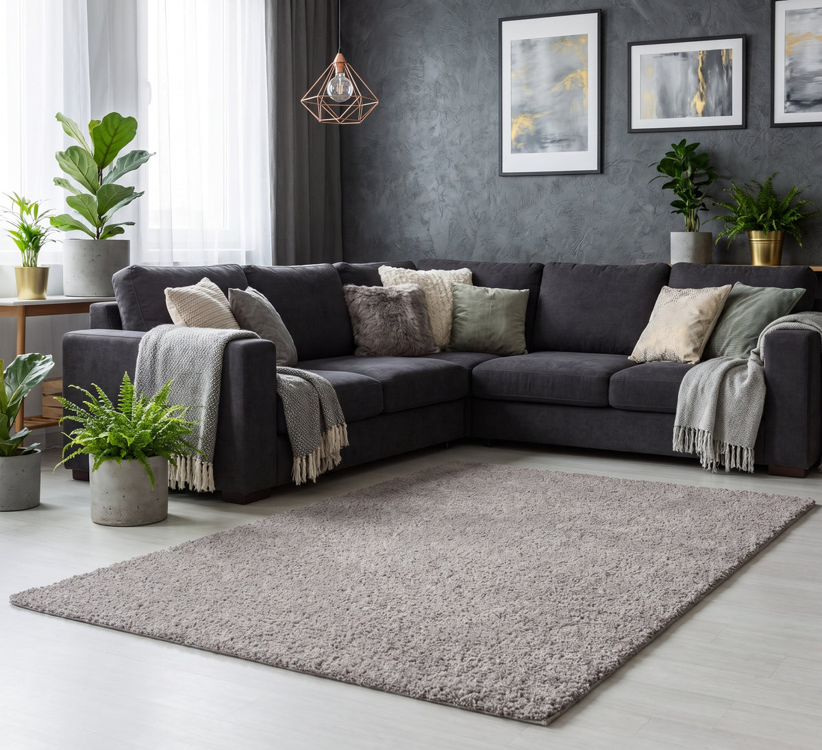 Empire Rug Grey, grey shaggy rug beside a dark corner sofa