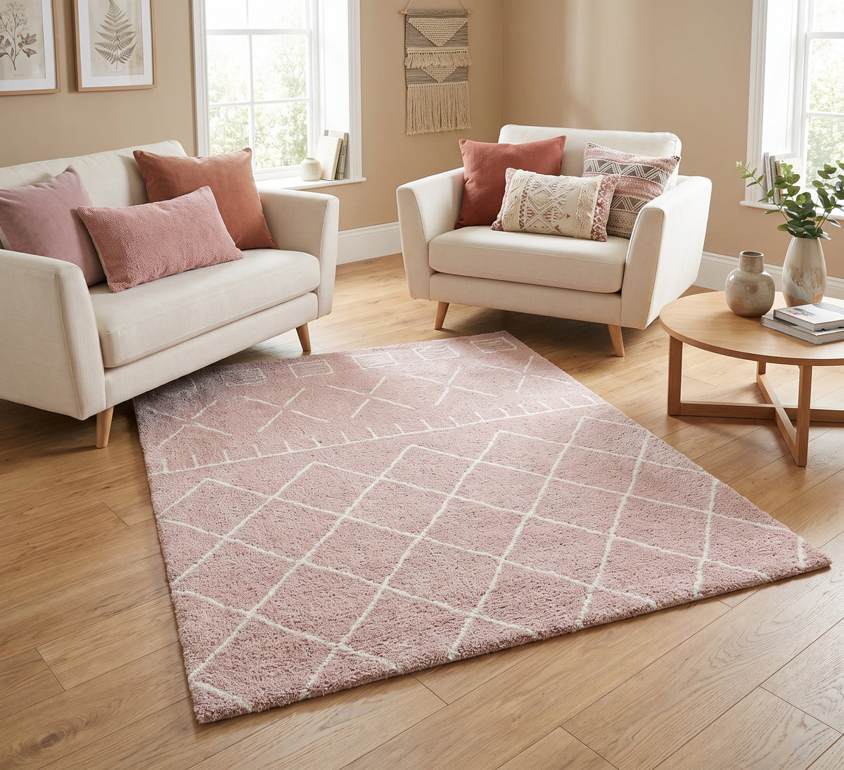 Harper 522 pink geometric rug styled between a cream sofa and armchair