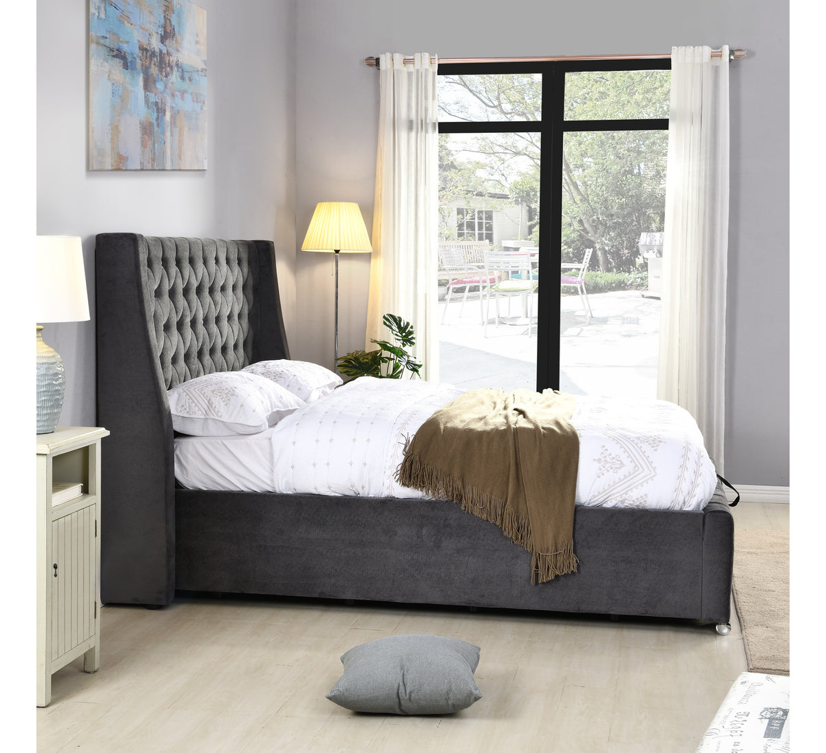 Jersey dark grey bed viewed from the side beside a window