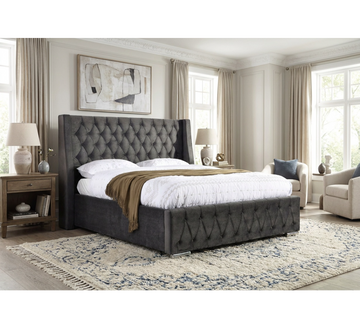 Jersey dark grey button-tufted bed styled in a bedroom with curtains and a bedside lamp