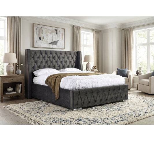 Jersey dark grey button-tufted bed styled in a bedroom with curtains and a bedside lamp