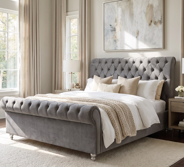 Kilkenny grey tufted bed styled with cream bedding in a bright bedroom
