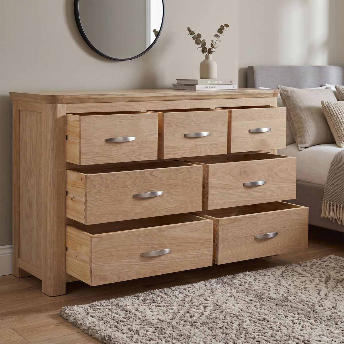 Treviso Oak 3 Over 4 Drawer Chest, bedroom setting with drawers open